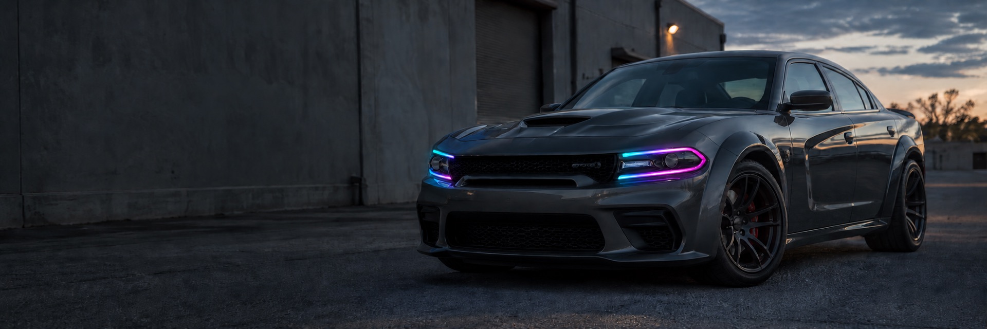 Illustration of a gray Charger with multicolor DRLs and unlit projector headlights