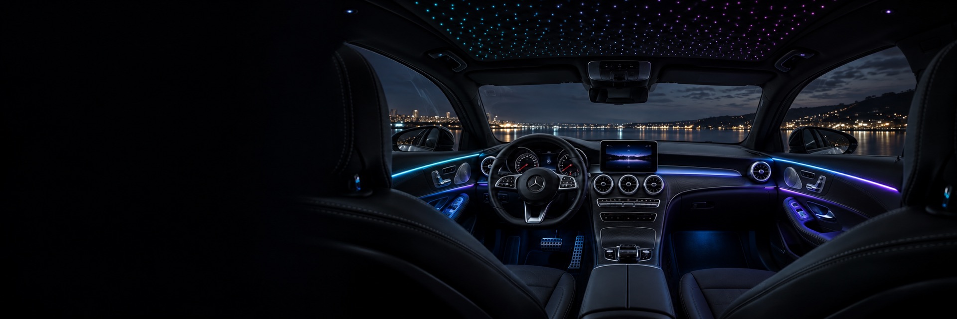 Car interior with cyan and violet ambient trim and a starlight headliner